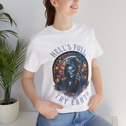 “Grim Humor: ‘Hell’s Full, Try Earth’ – A skull, adorned with the ominous aura of death, grins wickedly. Against a backdrop hinting at apocalyptic times, the text humorously suggests that even hell has reached capacity, leaving Earth as the next best option print in t-shirts in different colors like Aqua Athletic Heather Black Dark Grey Heather Heather Red Heather Team Purple Heather True Royal Kelly Navy Pink White.”