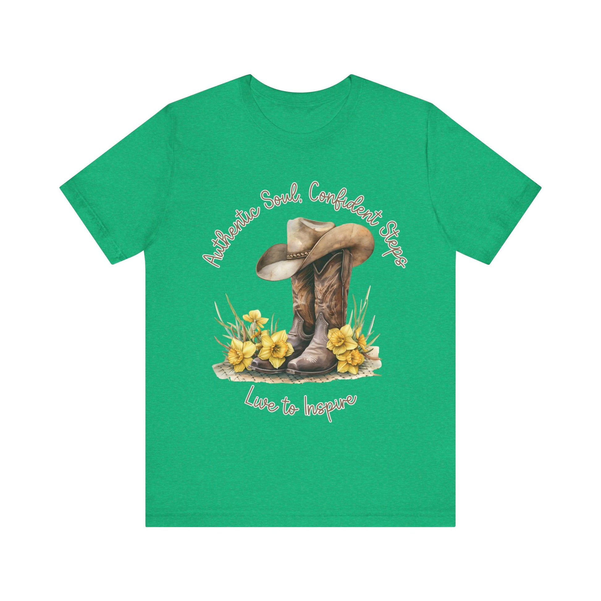 Brown leather cowboy boots with detailed stitching and a light brown hat on top, surrounded by green leaves and yellow flowers, with inspirational phrases ‘Authentic Soul,’ ‘Confident Steps,’ and ‘Live to Inspire’ written above and below on a white background colors tshirt Aqua Athletic Heather Baby Blue Black Dark Grey Heather Heather Kelly Heather Red Heather Team Purple Heather True Royal Navy Pink White Heather Aqua Heather Mauve Charity Pink.