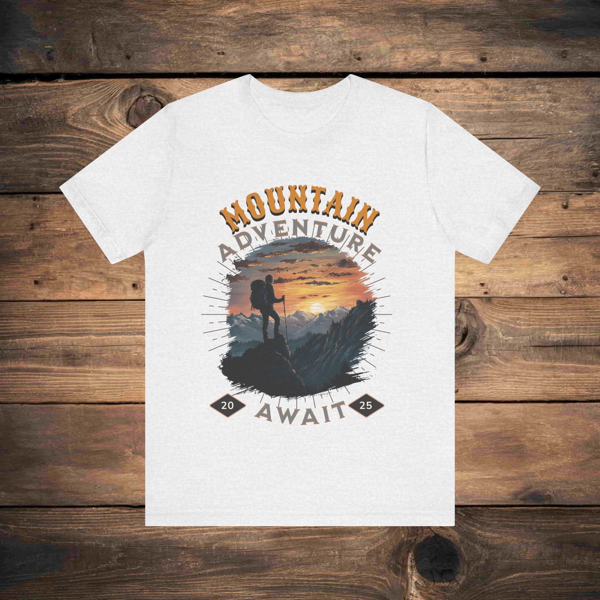 White cotton t-shirt with a bold mountain adventure graphic print, featuring a scenic mountain view at sunset