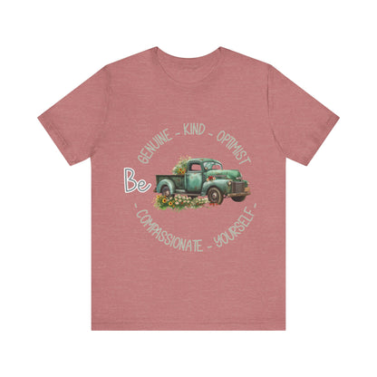 "Vintage green truck with floral decoration and inspirational words - featuring a classic old truck adorned with vibrant flowers on the sides, surrounded by the words 'Be genuine, bold, optimist, compassionate, kind, yourself', set in a beautiful context that promotes positivity and authenticity, color Aqua Athletic Heather Black Dark Grey Heather Heather Kelly Heather Navy Heather Red Heather True Royal Kelly Pink White Yellow Heather Aqua Heather Ice Blue Heather Mauve Charity Pink"