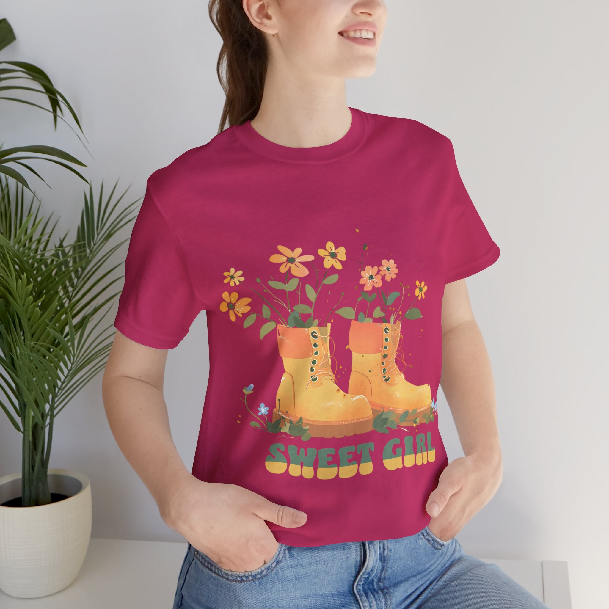 “Chic boho-style boots adorned with floral accents and ‘Sweet Girl’ text, featured on Bella Canvas 3001 t-shirts in a variety of hues Athletic Heather Berry Black Dark Grey Heather Heather Team Purple Navy White Heather Aqua Charity Pink.”