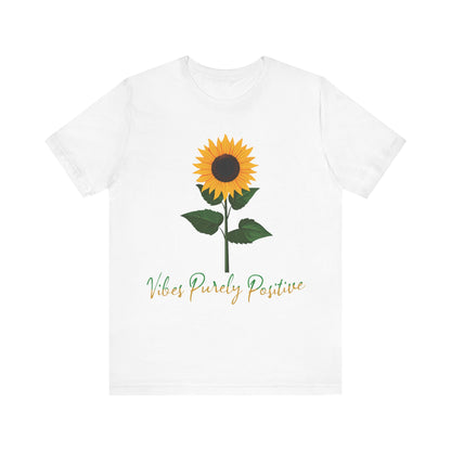 Sunflower illustration with 'Vibes Purely Positive' phrase - a vibrant sunflower with yellow petals and dark brown center, green leaves on a stem, conveying a positive message printed in t-shirts of different colors like "Army Athletic Heather Berry Black Heather Navy Heather Team Purple Navy White Ash Heather Aqua"