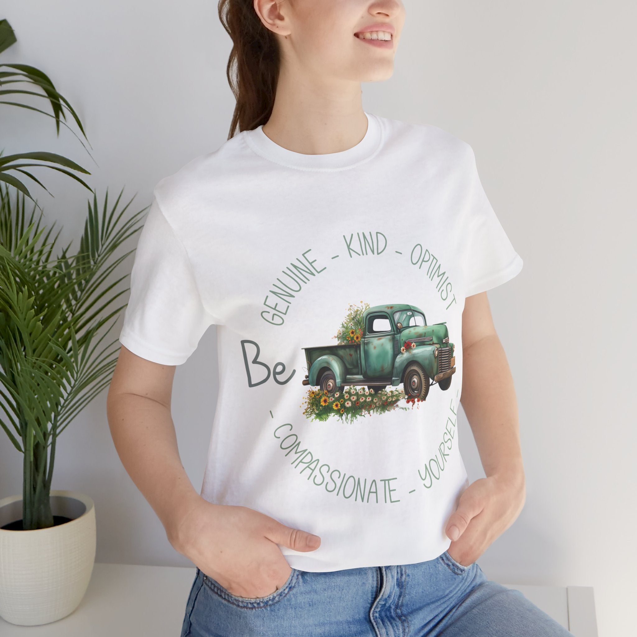 "Vintage green truck with floral decoration and inspirational words - featuring a classic old truck adorned with vibrant flowers on the sides, surrounded by the words 'Be genuine, bold, optimist, compassionate, kind, yourself', set in a beautiful context that promotes positivity and authenticity, color Aqua Athletic Heather Black Dark Grey Heather Heather Kelly Heather Navy Heather Red Heather True Royal Kelly Pink White Yellow Heather Aqua Heather Ice Blue Heather Mauve Charity Pink"