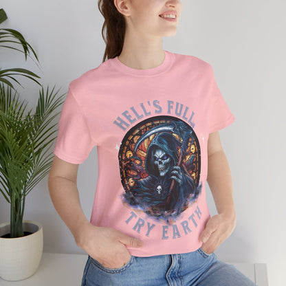 “Grim Humor: ‘Hell’s Full, Try Earth’ – A skull, adorned with the ominous aura of death, grins wickedly. Against a backdrop hinting at apocalyptic times, the text humorously suggests that even hell has reached capacity, leaving Earth as the next best option print in t-shirts in different colors like Aqua Athletic Heather Black Dark Grey Heather Heather Red Heather Team Purple Heather True Royal Kelly Navy Pink White.”