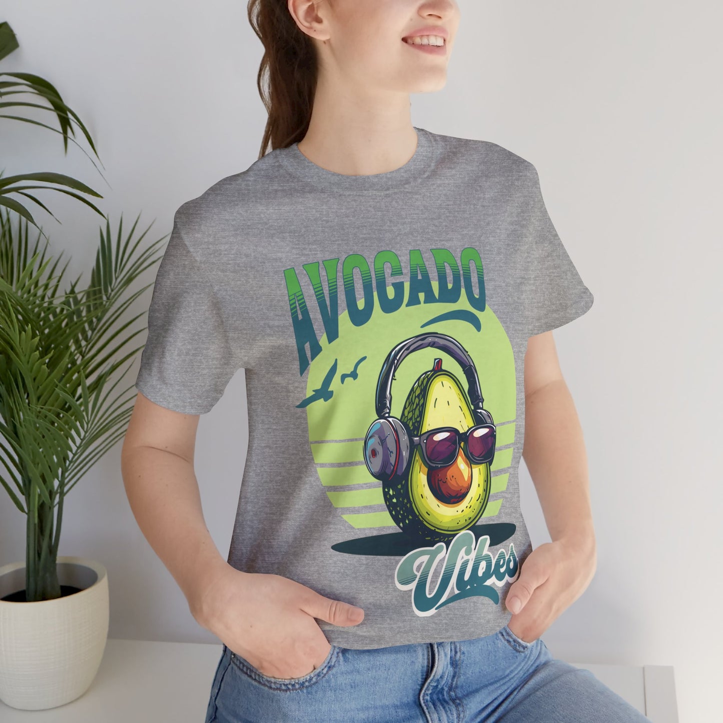 Avocado with headphones and glasses design on Bella Canvas 3001 T-shirt available in Aqua, Athletic Heather, Berry, Black, Dark Grey Heather, Heather Kelly, Heather Navy, Heather Red, Heather Team Purple, Navy, True Royal, White, Heather Aqua.