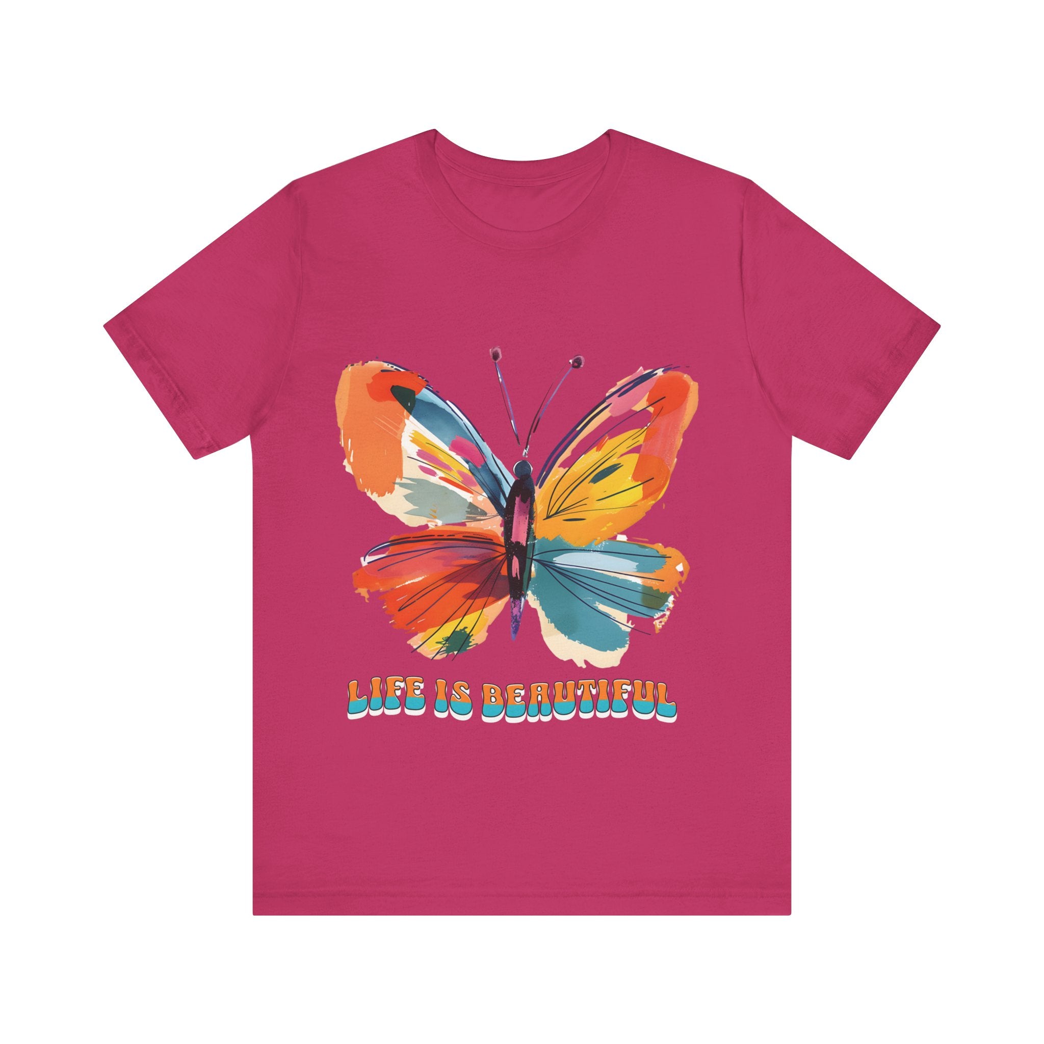 Colorful cartoon-style butterfly with vibrant wings and the text 'Life is Beautiful' designed for t-shirts in colors including Aqua, Athletic Heather, Berry, Black, Dark Grey Heather, Heather Red, Heather Team Purple, Heather True Royal, White, and Charity Pink.