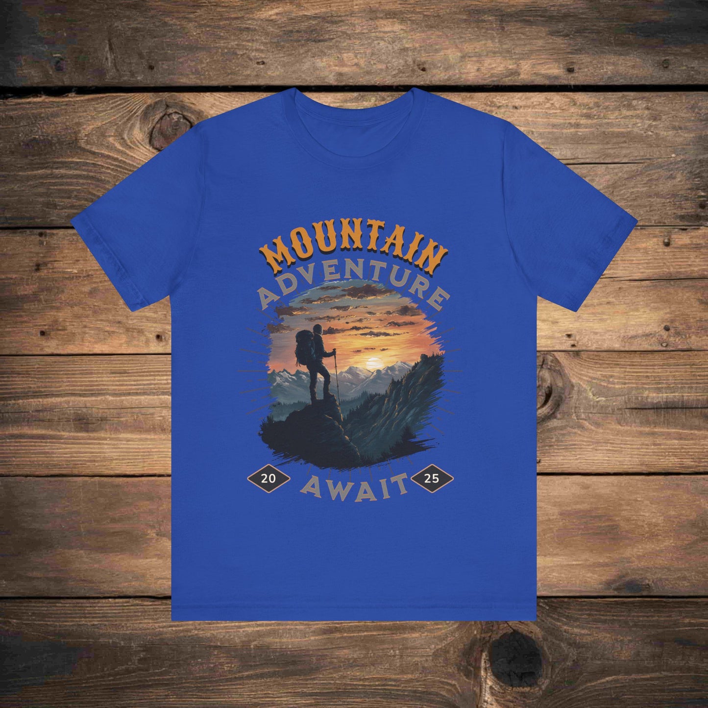 Adventure graphic tee in blue, true royal with a detailed mountain sunset illustration, ideal for outdoor enthusiasts