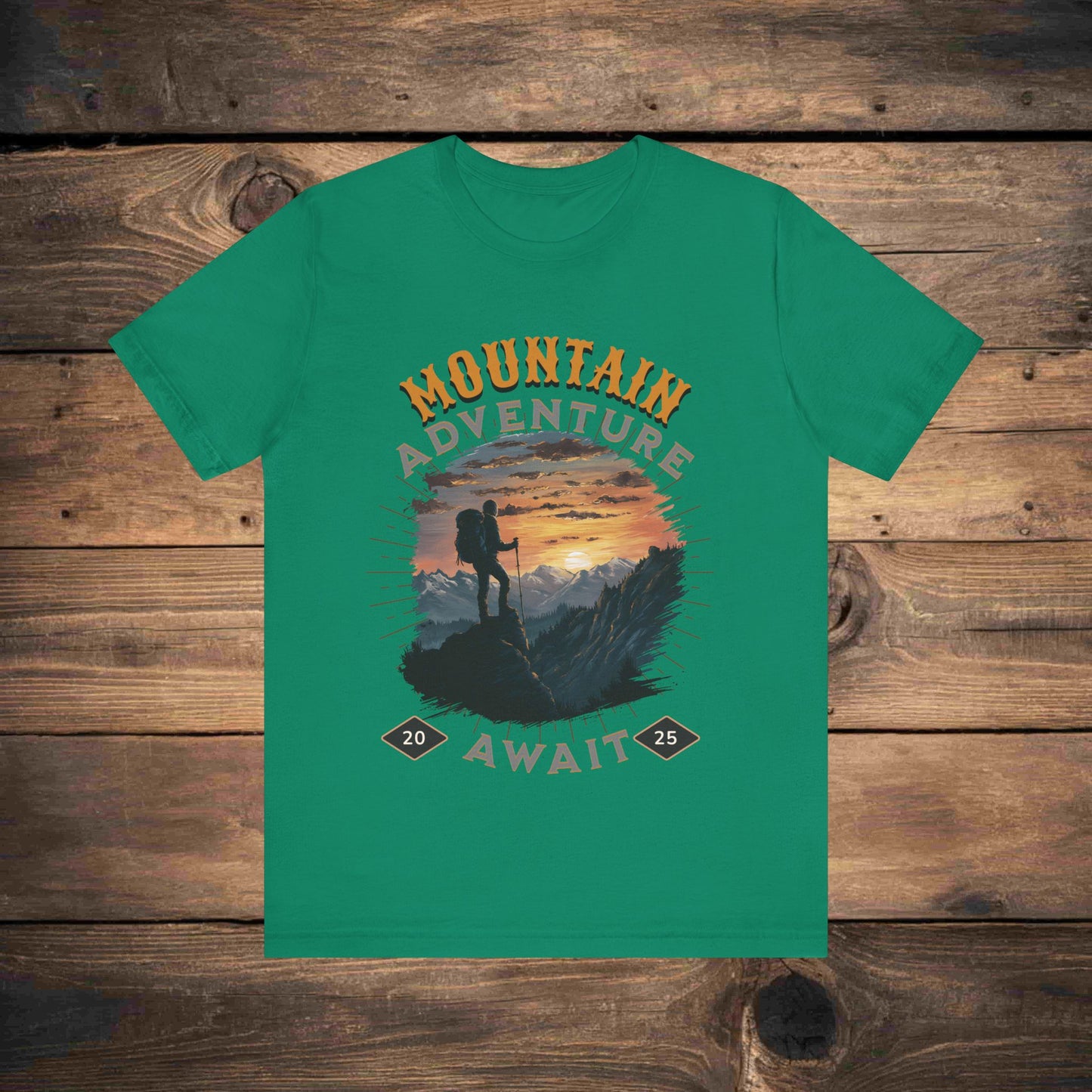 Adventure graphic tee in kelly with a detailed mountain sunset illustration, ideal for outdoor enthusiasts