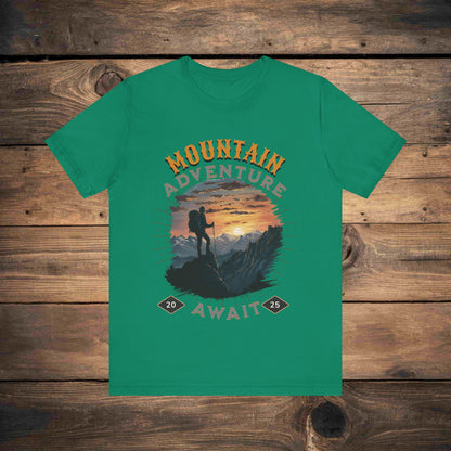 Adventure graphic tee in kelly with a detailed mountain sunset illustration, ideal for outdoor enthusiasts