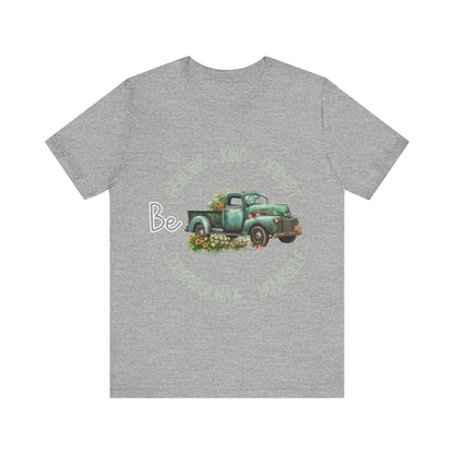 "Vintage green truck with floral decoration and inspirational words - featuring a classic old truck adorned with vibrant flowers on the sides, surrounded by the words 'Be genuine, bold, optimist, compassionate, kind, yourself', set in a beautiful context that promotes positivity and authenticity, color Aqua Athletic Heather Black Dark Grey Heather Heather Kelly Heather Navy Heather Red Heather True Royal Kelly Pink White Yellow Heather Aqua Heather Ice Blue Heather Mauve Charity Pink"