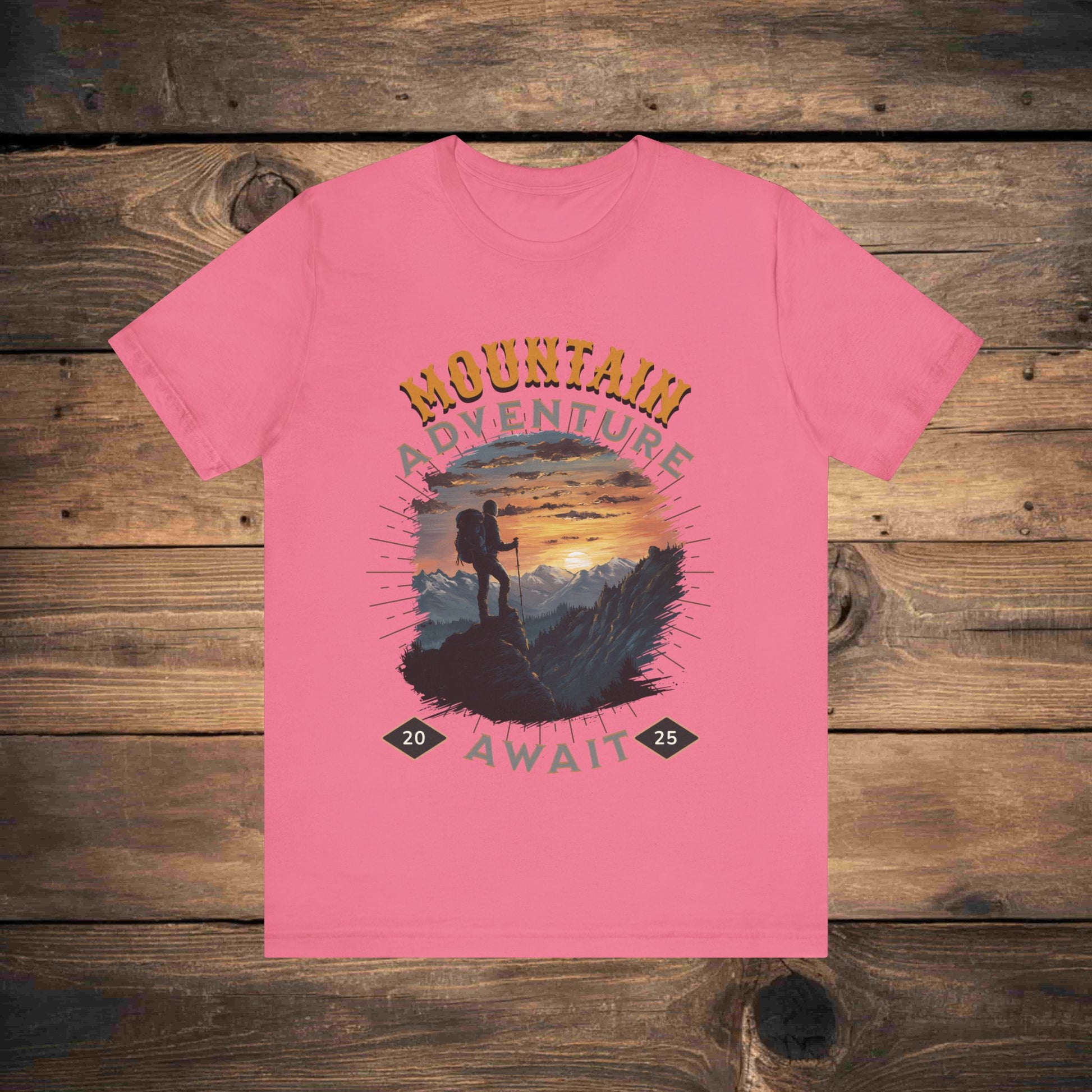 Adventure graphic tee in Charity Pink with a detailed mountain sunset illustration, ideal for outdoor enthusiasts