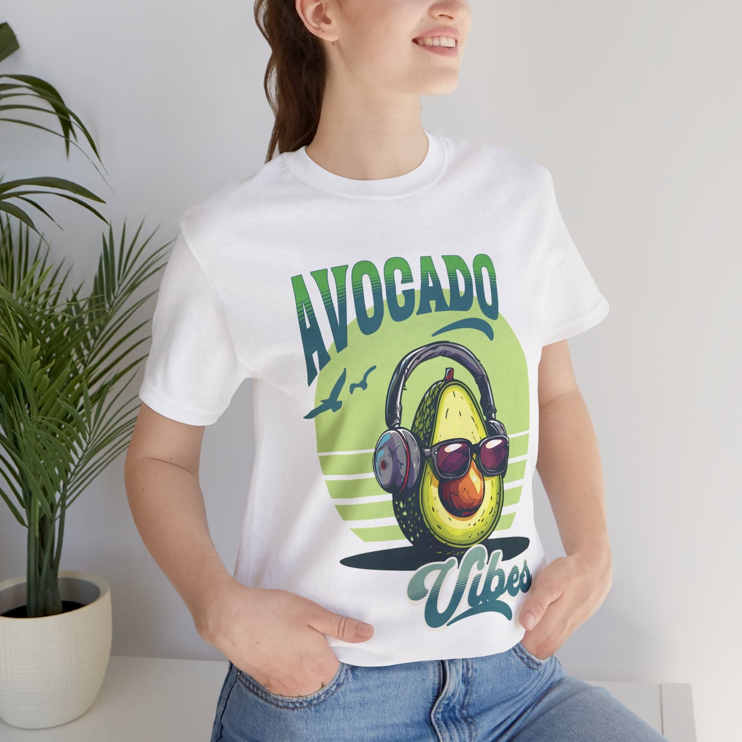 Avocado with headphones and glasses design on Bella Canvas 3001 T-shirt available in Aqua, Athletic Heather, Berry, Black, Dark Grey Heather, Heather Kelly, Heather Navy, Heather Red, Heather Team Purple, Navy, True Royal, White, Heather Aqua.