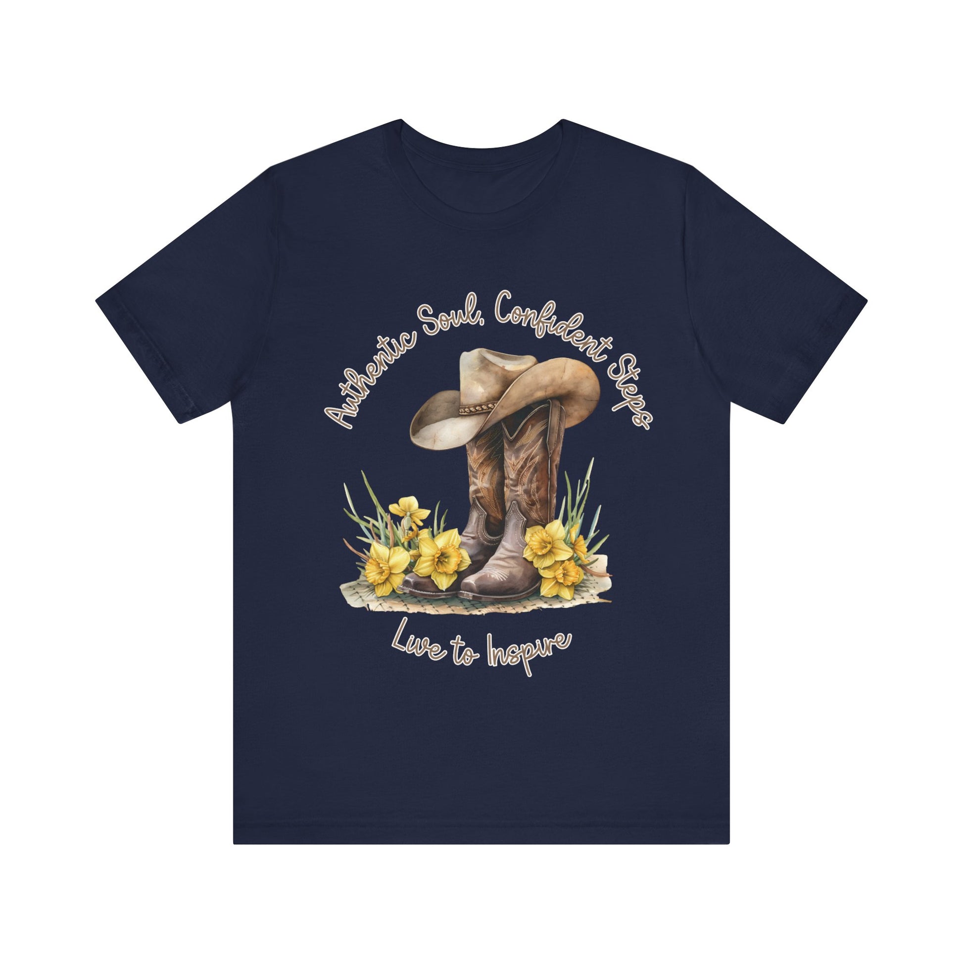 Brown leather cowboy boots with detailed stitching and a light brown hat on top, surrounded by green leaves and yellow flowers, with inspirational phrases ‘Authentic Soul,’ ‘Confident Steps,’ and ‘Live to Inspire’ written above and below on a white background colors tshirt Aqua Athletic Heather Baby Blue Black Dark Grey Heather Heather Kelly Heather Red Heather Team Purple Heather True Royal Navy Pink White Heather Aqua Heather Mauve Charity Pink.