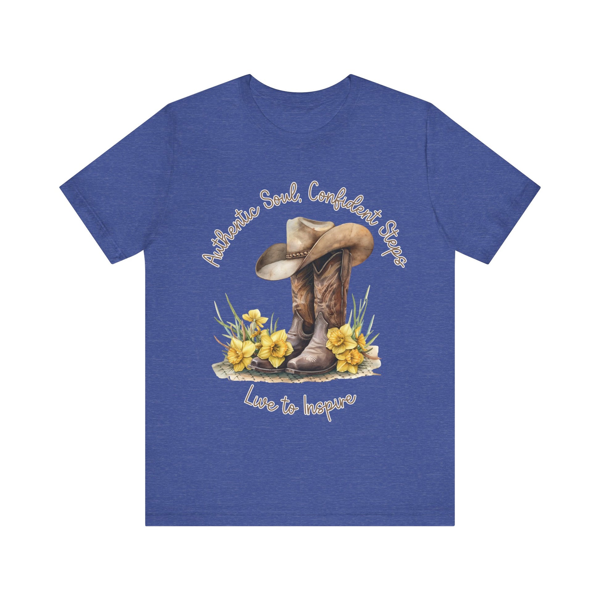 Brown leather cowboy boots with detailed stitching and a light brown hat on top, surrounded by green leaves and yellow flowers, with inspirational phrases ‘Authentic Soul,’ ‘Confident Steps,’ and ‘Live to Inspire’ written above and below on a white background colors tshirt Aqua Athletic Heather Baby Blue Black Dark Grey Heather Heather Kelly Heather Red Heather Team Purple Heather True Royal Navy Pink White Heather Aqua Heather Mauve Charity Pink.