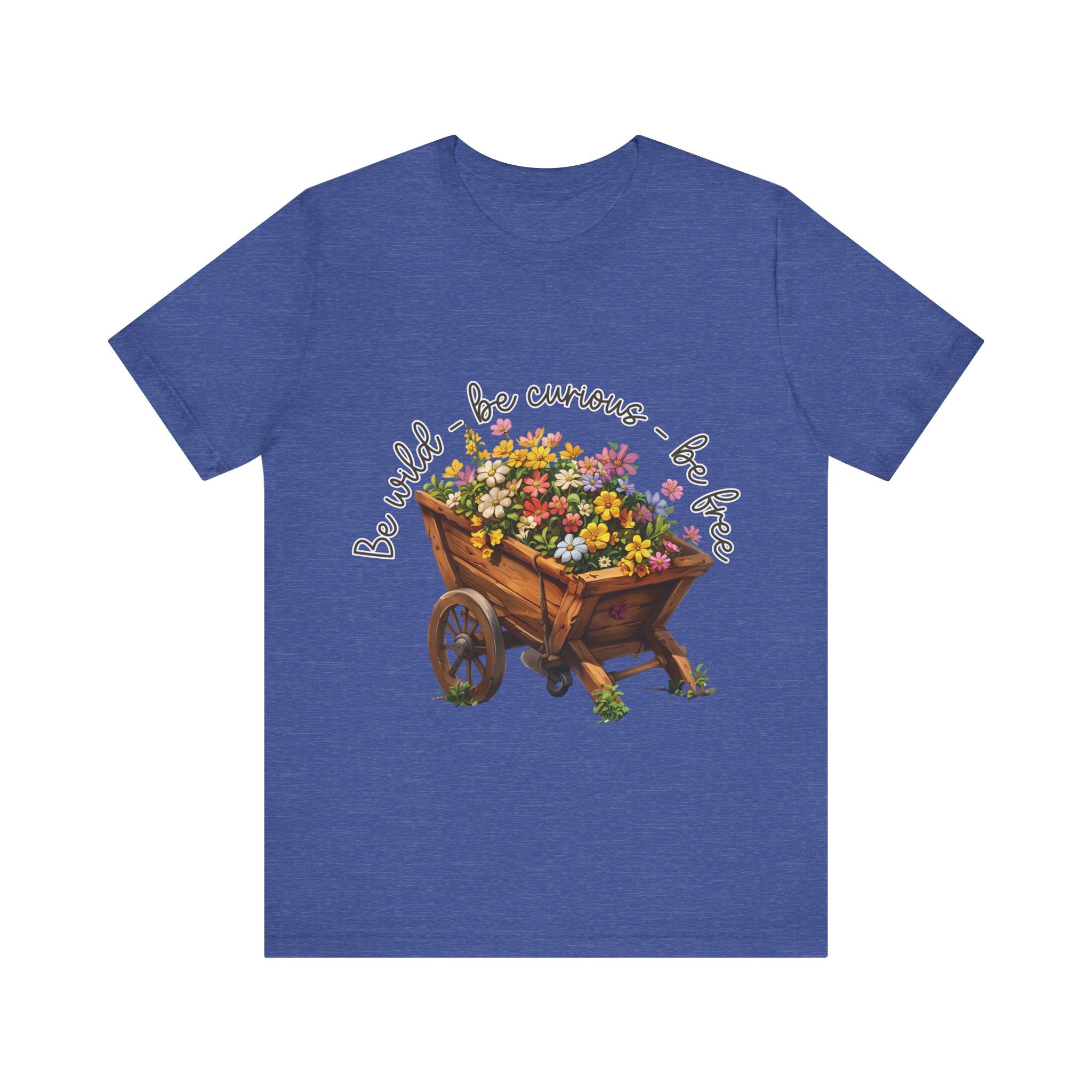 Colorful illustration of a wooden wheelbarrow filled with vibrant flowers, surrounded by the handwritten text 'Be wild - be curious - be free.' This design is intended for t-shirts in various colors, including Aqua, Athletic Heather, Black, Dark Grey Heather, Heather Kelly, Heather Red, Heather True Royal, Natural, Navy, Pink, White, Heather Aqua, Heather Ice Blue, Heather Mauve, and Charity Pink.