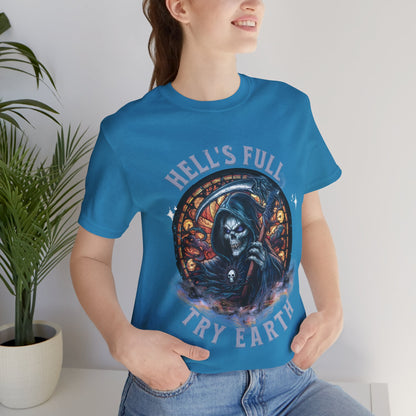 “Grim Humor: ‘Hell’s Full, Try Earth’ – A skull, adorned with the ominous aura of death, grins wickedly. Against a backdrop hinting at apocalyptic times, the text humorously suggests that even hell has reached capacity, leaving Earth as the next best option print in t-shirts in different colors like Aqua Athletic Heather Black Dark Grey Heather Heather Red Heather Team Purple Heather True Royal Kelly Navy Pink White.”