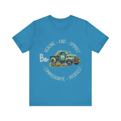 "Vintage green truck with floral decoration and inspirational words - featuring a classic old truck adorned with vibrant flowers on the sides, surrounded by the words 'Be genuine, bold, optimist, compassionate, kind, yourself', set in a beautiful context that promotes positivity and authenticity, color Aqua Athletic Heather Black Dark Grey Heather Heather Kelly Heather Navy Heather Red Heather True Royal Kelly Pink White Yellow Heather Aqua Heather Ice Blue Heather Mauve Charity Pink"