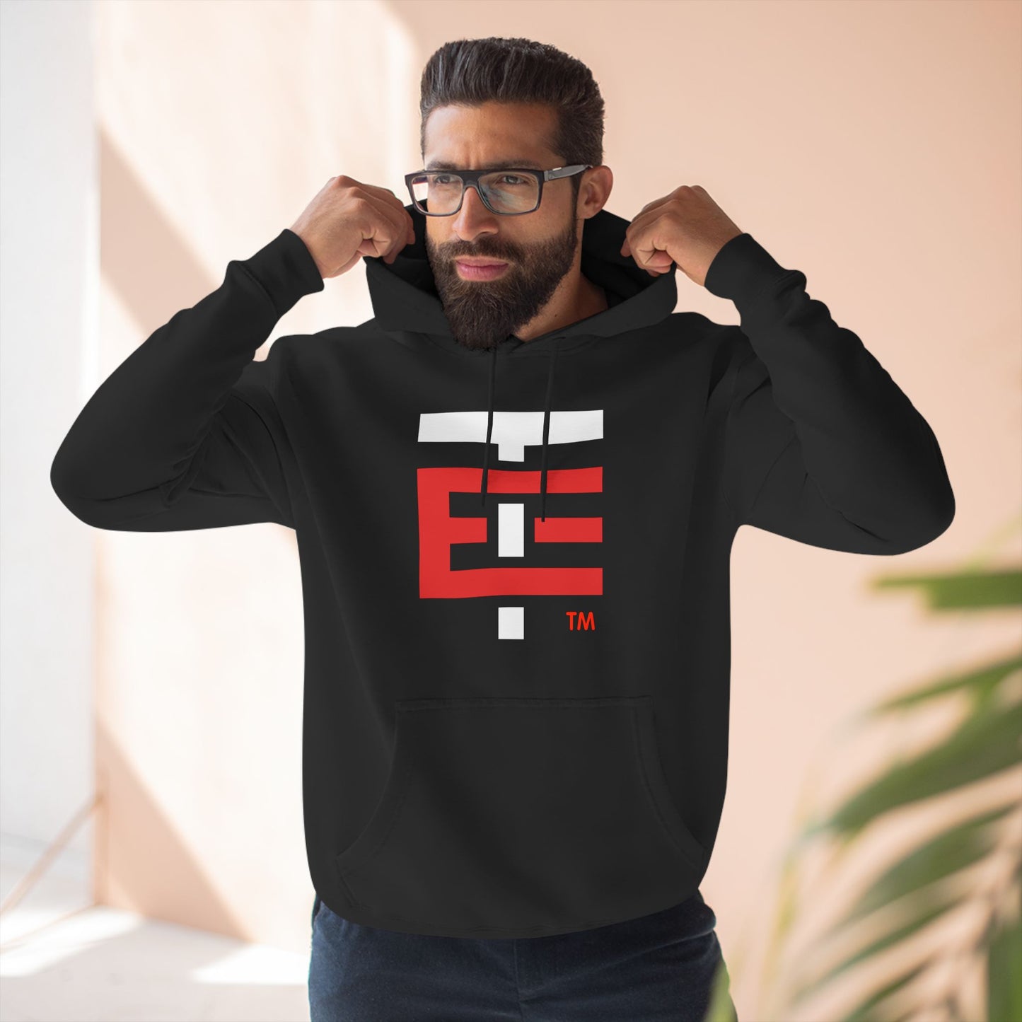 El Temach Hoodies, weaters, buzos, Men's black hoodie with bold red and white graphic logo, fleece-lined for warmth.