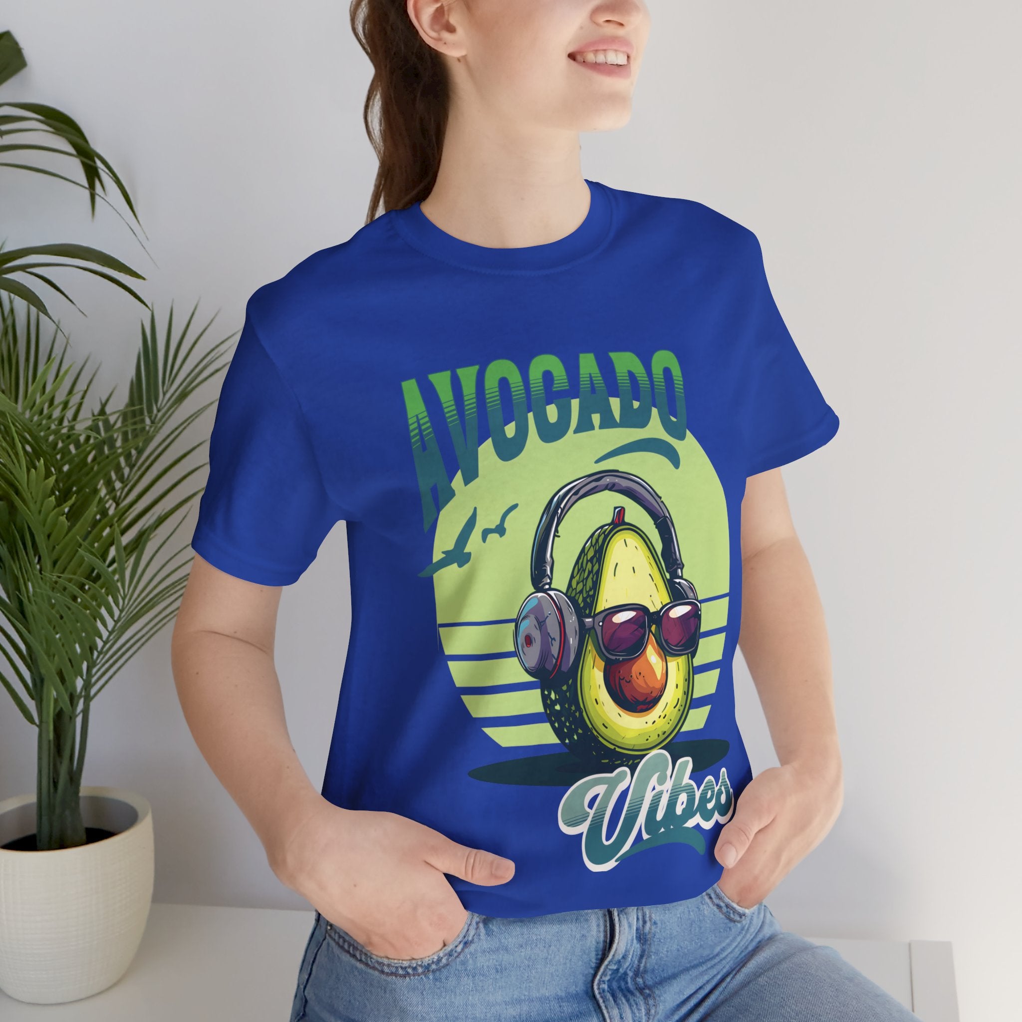 Avocado with headphones and glasses design on Bella Canvas 3001 T-shirt available in Aqua, Athletic Heather, Berry, Black, Dark Grey Heather, Heather Kelly, Heather Navy, Heather Red, Heather Team Purple, Navy, True Royal, White, Heather Aqua.