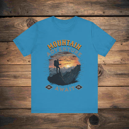 Adventure graphic tee in Blue with a detailed mountain sunset illustration, ideal for outdoor enthusiasts