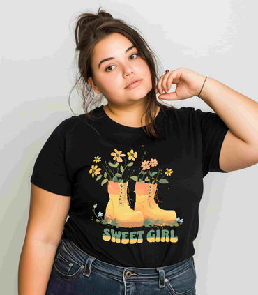 “Chic boho-style boots adorned with floral accents and ‘Sweet Girl’ text, featured on Bella Canvas 3001 t-shirts in a variety of hues Athletic Heather Berry Black Dark Grey Heather Heather Team Purple Navy White Heather Aqua Charity Pink.”