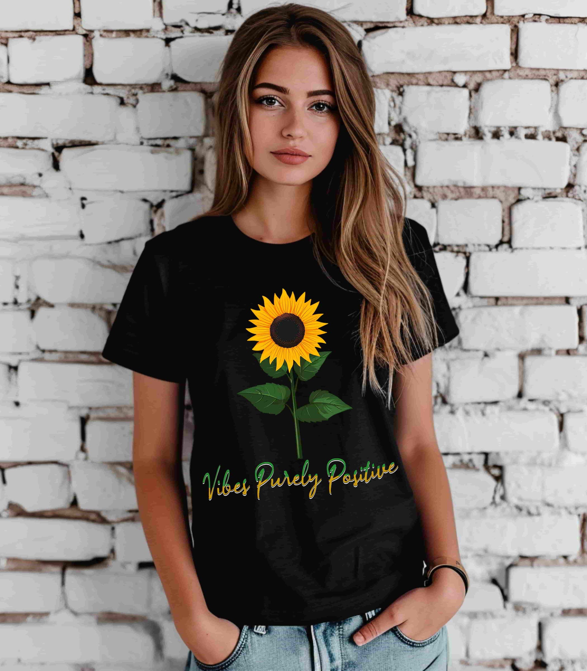 Sunflower illustration with 'Vibes Purely Positive' phrase - a vibrant sunflower with yellow petals and dark brown center, green leaves on a stem, conveying a positive message printed in t-shirts of different colors like "Army Athletic Heather Berry Black Heather Navy Heather Team Purple Navy White Ash Heather Aqua"