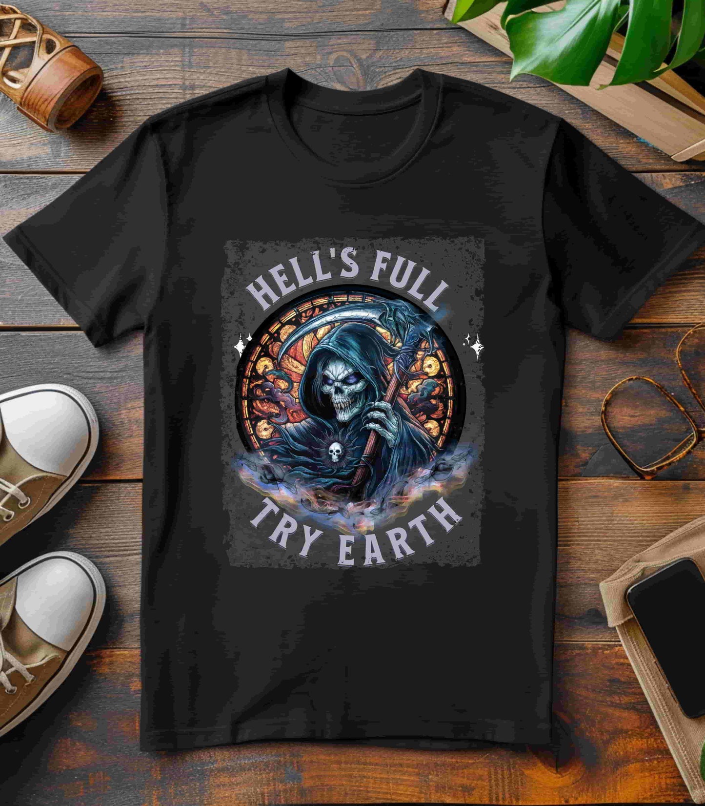 “Grim Humor: ‘Hell’s Full, Try Earth’ – A skull, adorned with the ominous aura of death, grins wickedly. Against a backdrop hinting at apocalyptic times, the text humorously suggests that even hell has reached capacity, leaving Earth as the next best option print in t-shirts in different colors like Aqua Athletic Heather Black Dark Grey Heather Heather Red Heather Team Purple Heather True Royal Kelly Navy Pink White.”